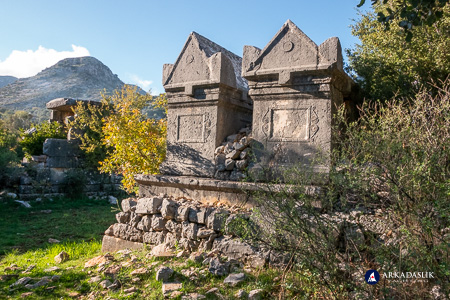 Two elevated monumental tombs on a stone platform at Sidyma