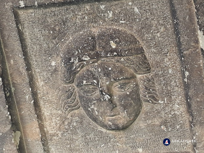 Carved face on the decorated ceiling of the Sidyma tomb