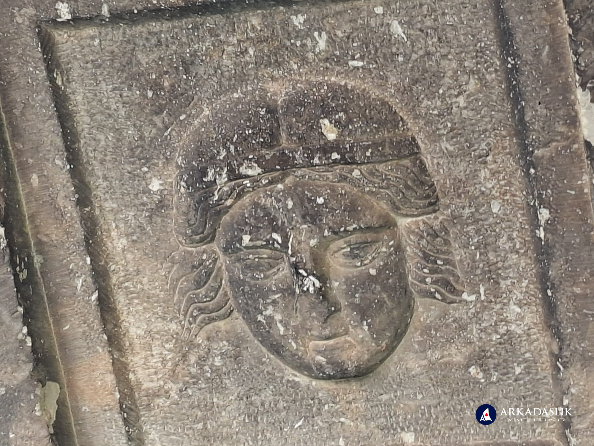 Carved face on the decorated ceiling of the Sidyma tomb