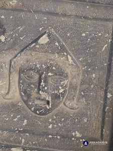 Decorated face carved into the ceiling coffers of the Sidyma tomb