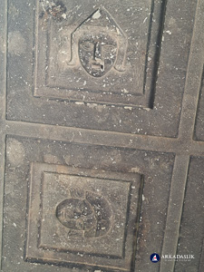 Two carved faces from the cassette-ceiling tomb at Sidyma