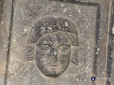 Detail of a carved face from the Sidyma cassette-ceiling tomb