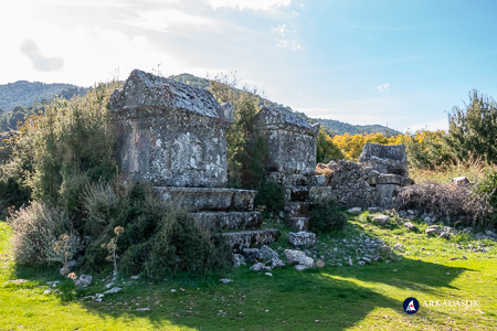 Close-up view of monumental tombs elevated on stone podiums at Sidyma