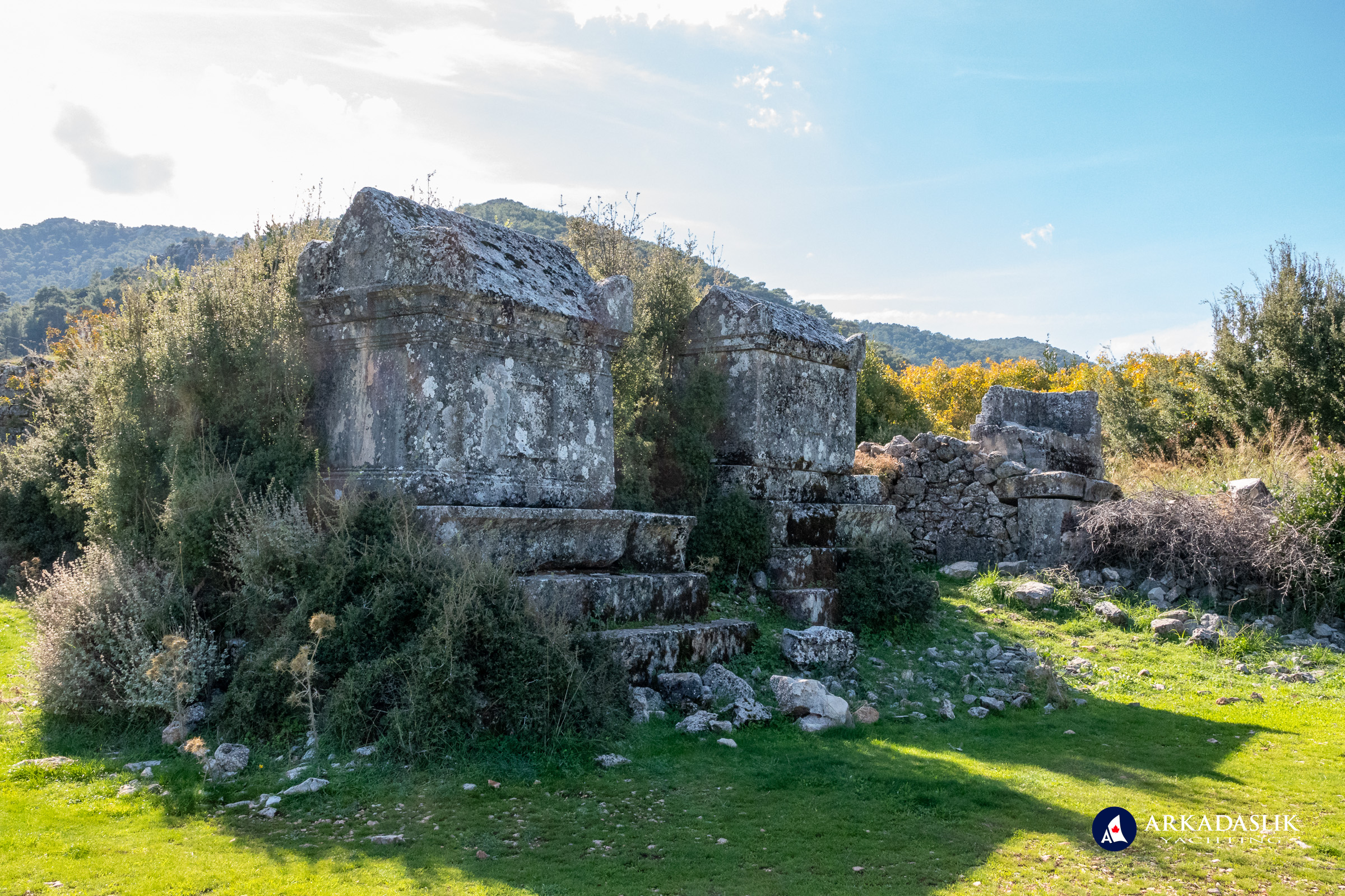Close-up view of monumental tombs elevated on stone podiums at Sidyma