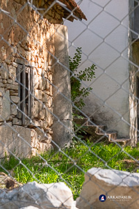 Marble column incorporated into a contemporary building in Dodurga