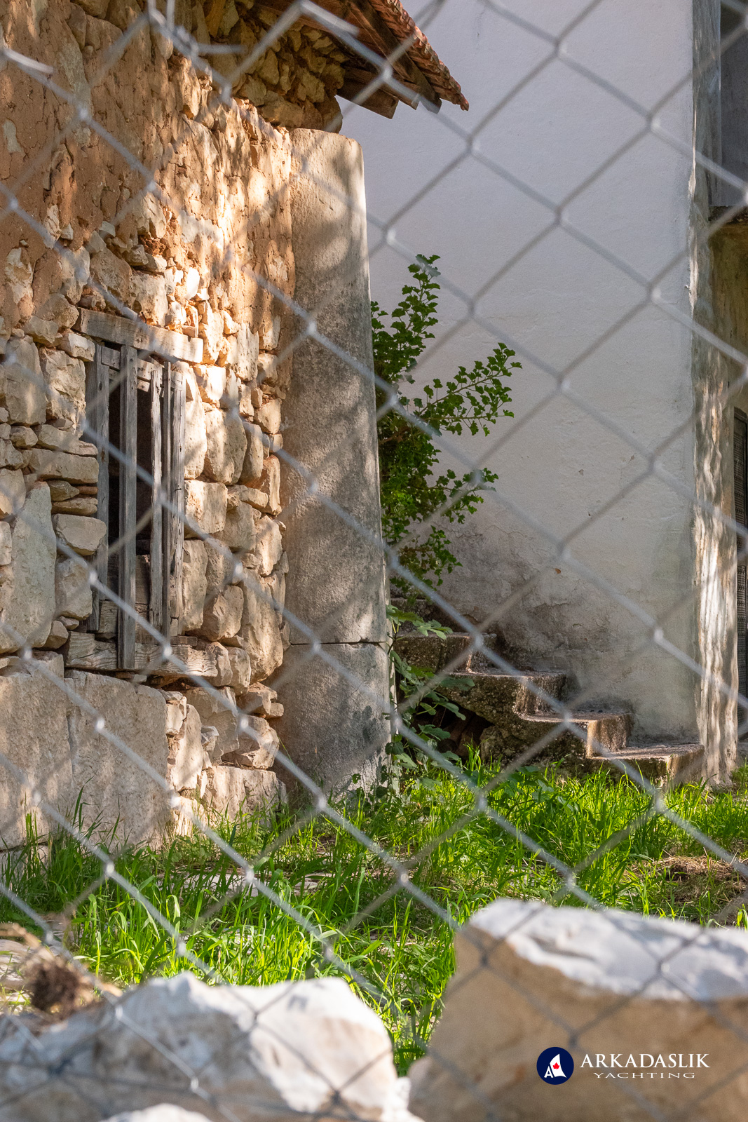 Marble column incorporated into a contemporary building in Dodurga