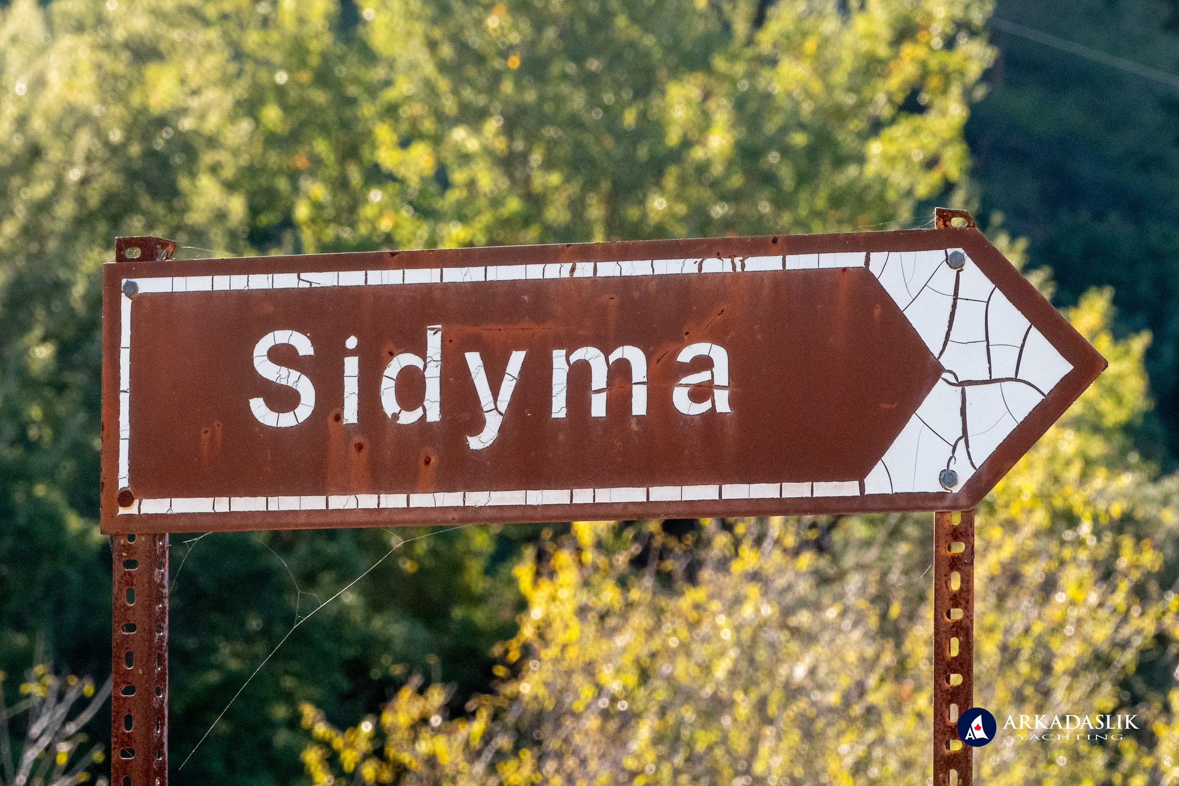 Directional sign pointing toward Sidyma Antique City