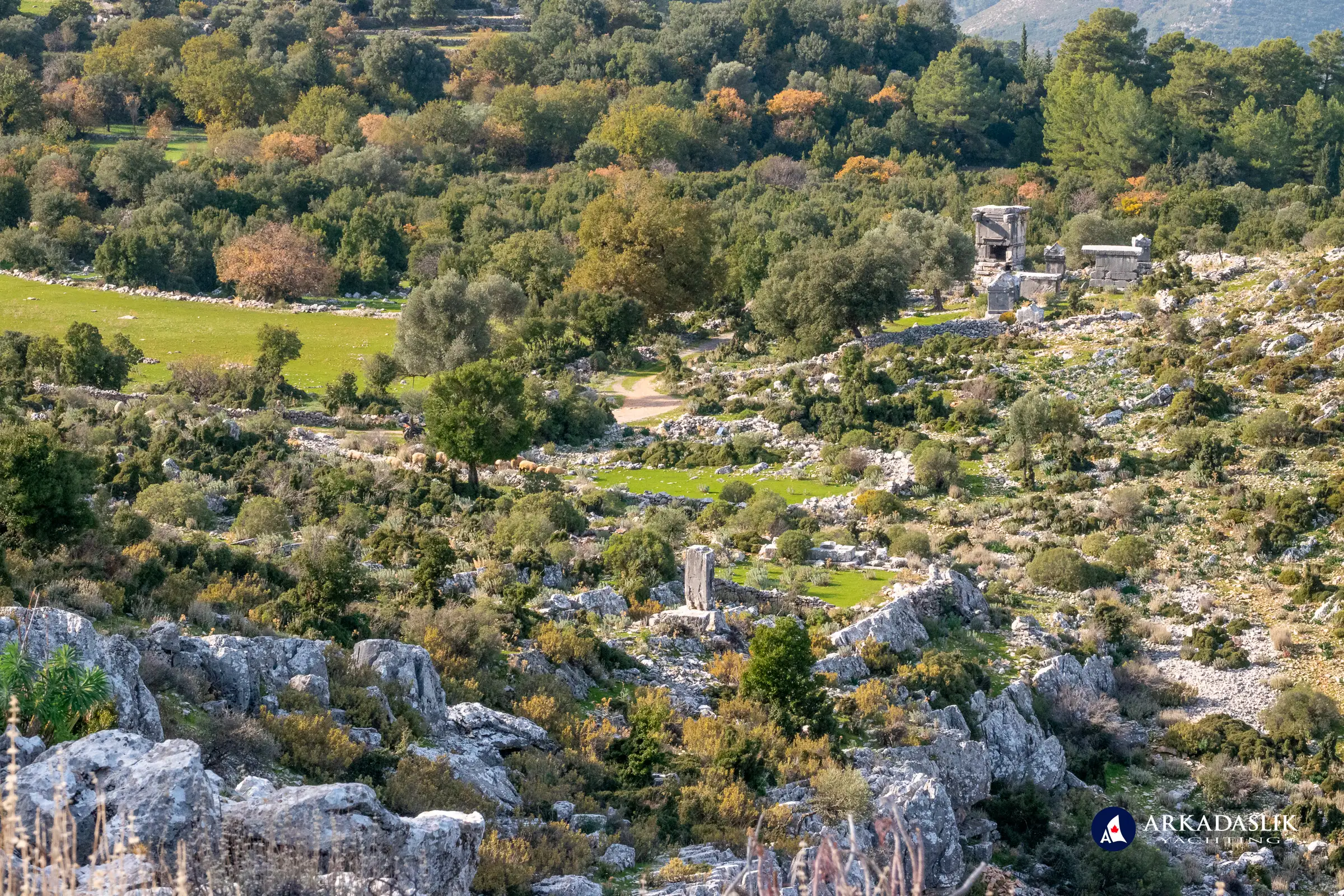 Cluster of tombs in the background and the ruins of an ancient watchtower in the foreground